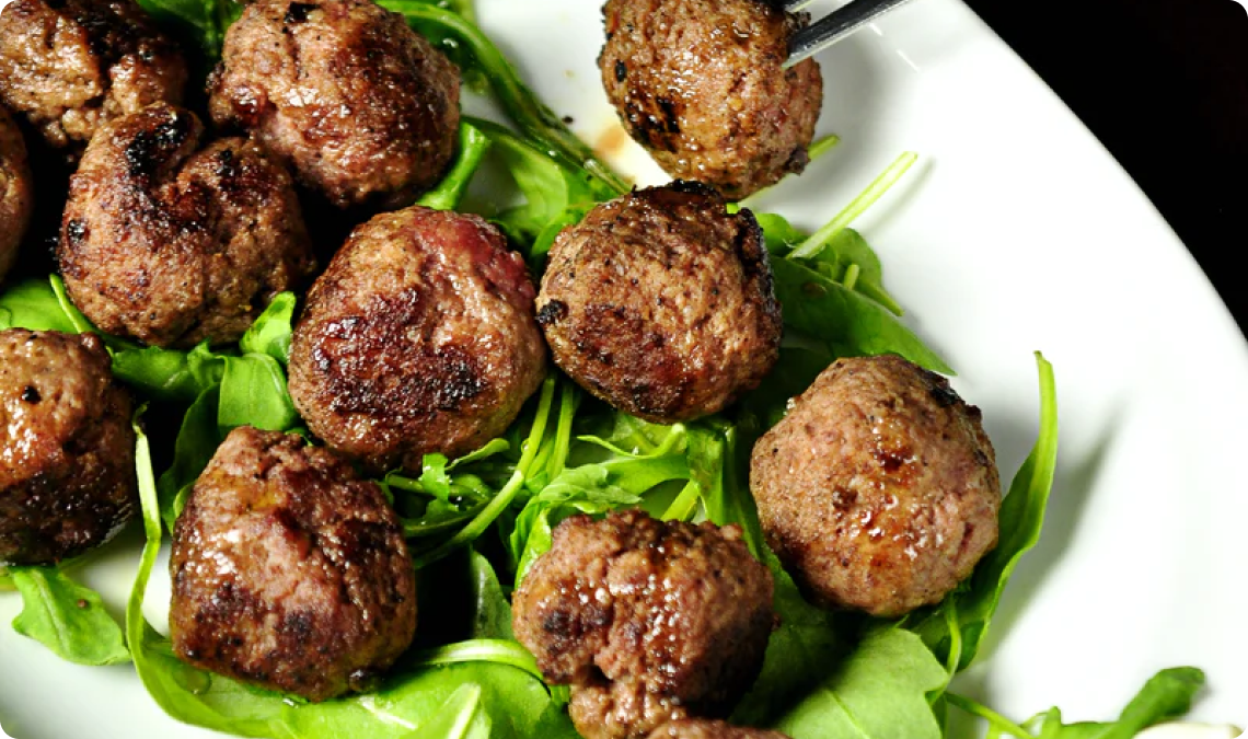 meatballs on a bed of greens